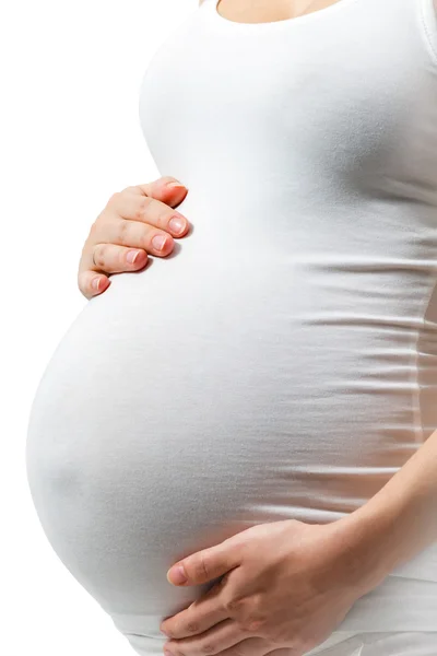 Kobieta w ciąży tutaj dotyka brzucha — Zdjęcie stockowe