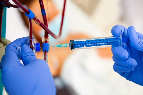 Taking blood sample with syringe — Stock Photo, Image