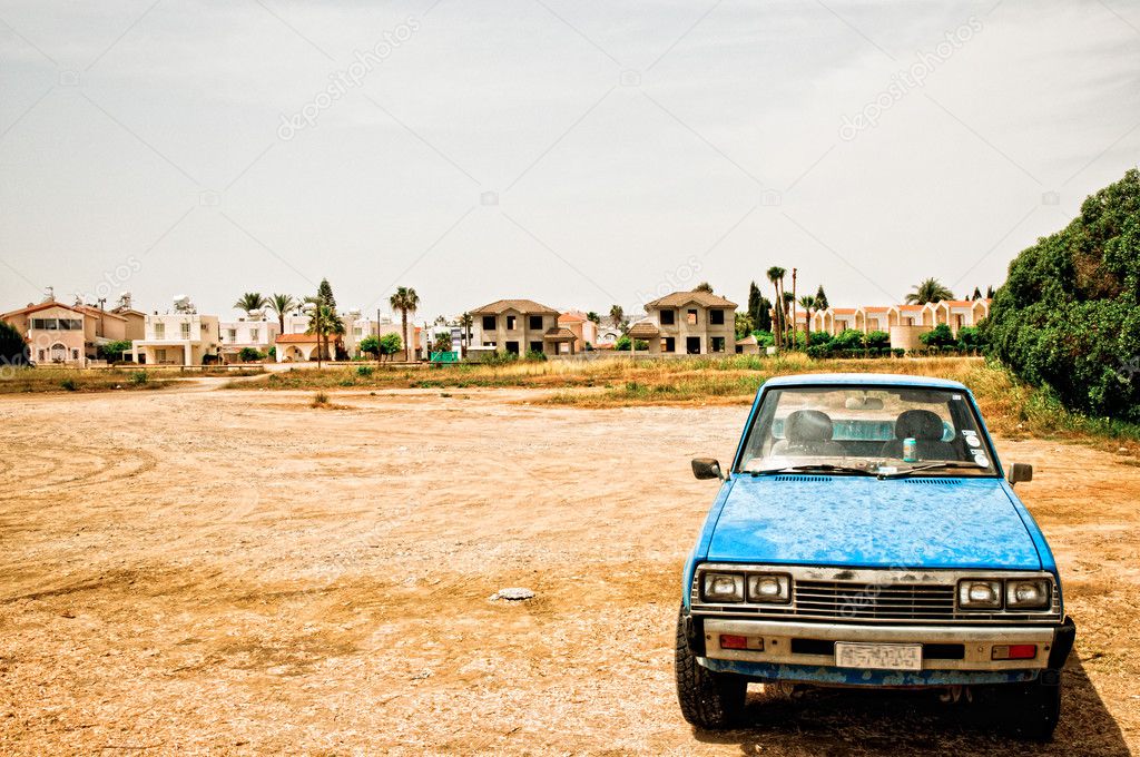 Old car in desolate landscape