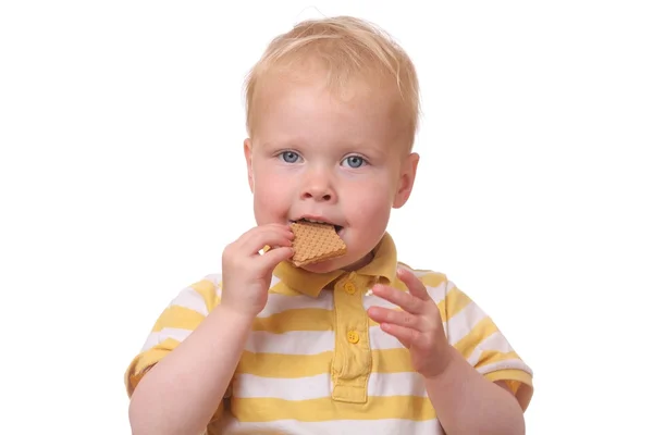 Kind eten cookies — Stockfoto