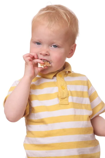 Kind isst Kekse — Stockfoto