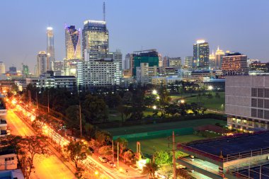 Bangkok cityscape skyscraper with light trail of freeway to the clipart