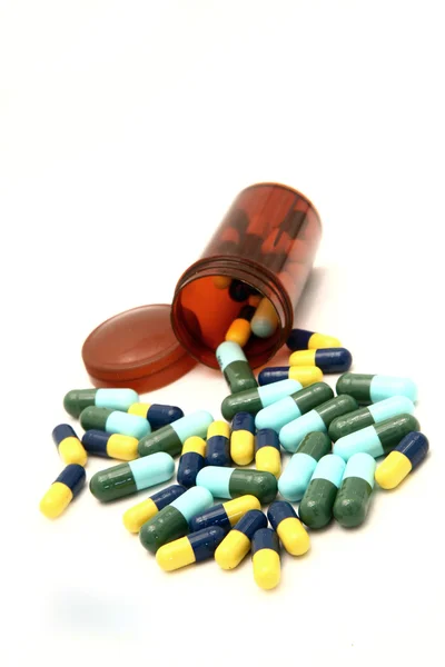 Perspectiva de cápsulas e frasco de pílula — Fotografia de Stock