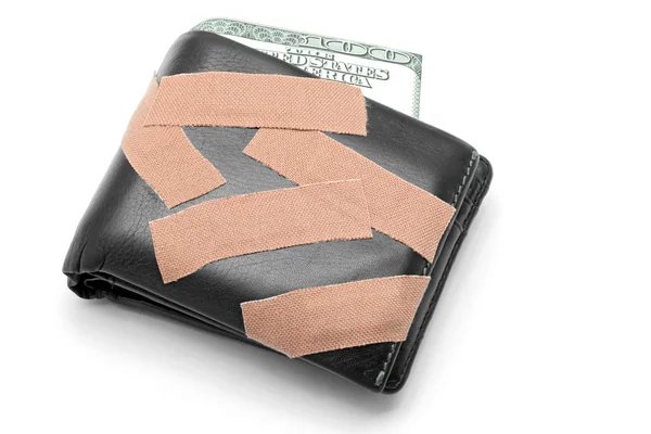 Dinheiro na carteira com gesso médico — Fotografia de Stock