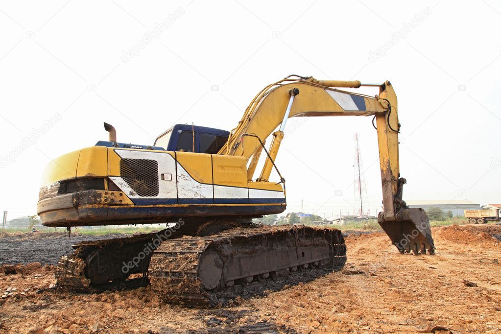 Excavator Loader with backhoe standing in sandpit