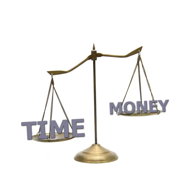Time is greater money concept on golden brass scales — Stock Photo, Image