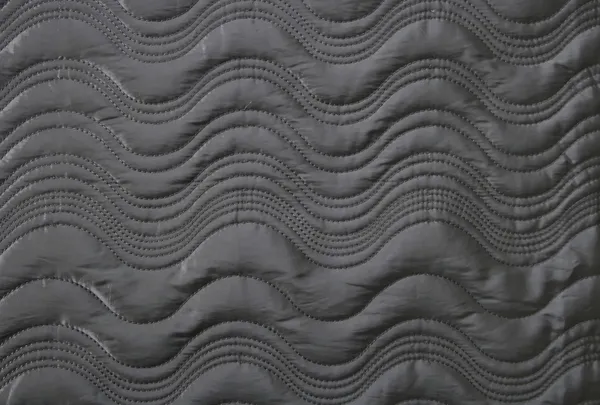 Zwarte golvende doek textuur — Stockfoto