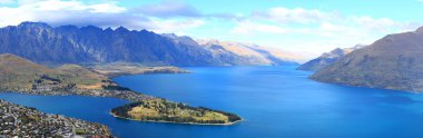 Panorama of lake Wakatipu and Queenstown downtown skyline, New Z clipart