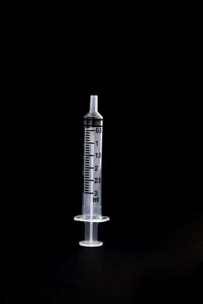 Isolated syringe on black background — Stock Photo, Image