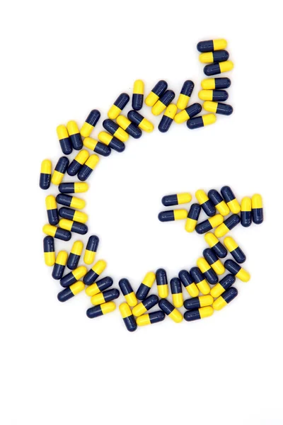La lettera G alfabeto fatto di capsule mediche — Foto Stock