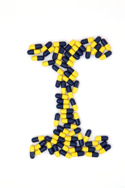The letter I alphabet made of medical capsules — Stock Photo, Image