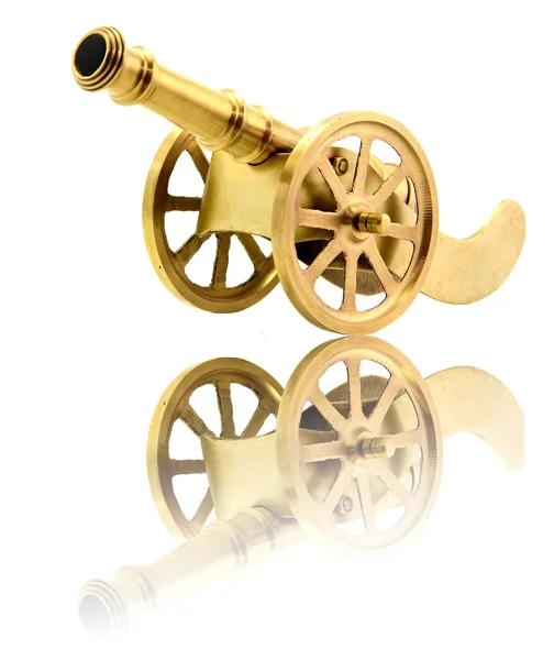 Isolated golden canon on white with its reflection — Stock Photo, Image