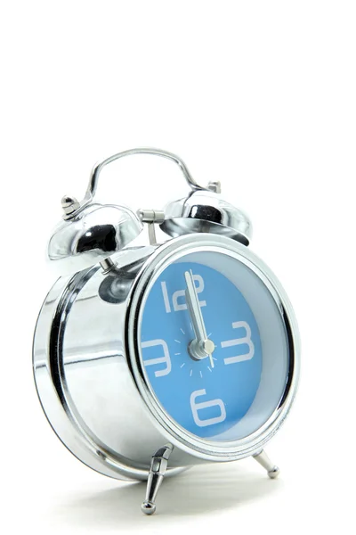 Isolated blue alarm clock on white side perspective — Stock Photo, Image