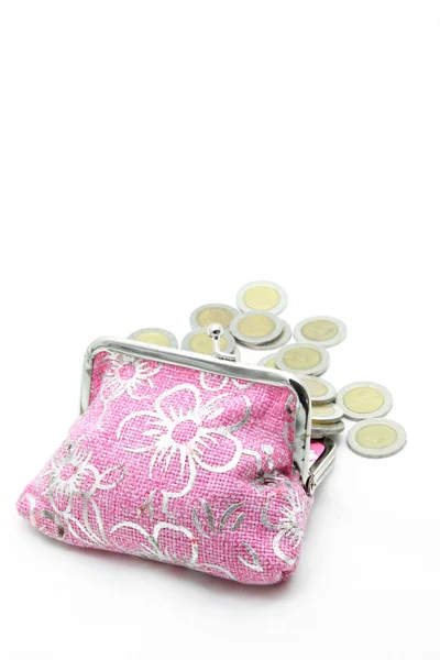 Ömlött ki a virág pink pénzt zsákot vagy erszényes elszigetelt érmék — Stock Fotó