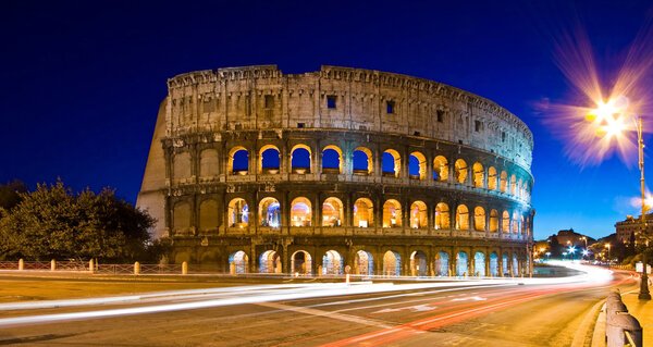 Light trails at Colosseum in twilight, Rome Italy