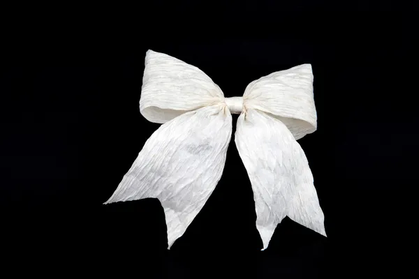 Perspective of isolated white bow for holiday gift box on black — Stock Photo, Image