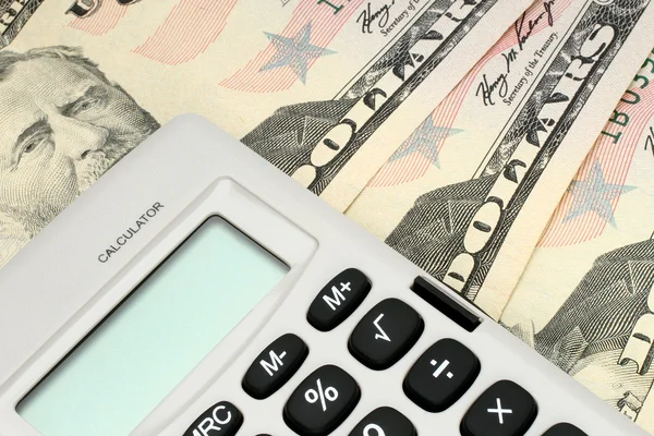 Kalkulačka s penězi — Stock fotografie