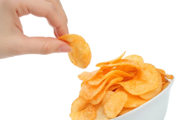 Hand with potato chips and bowl — Stock Photo, Image