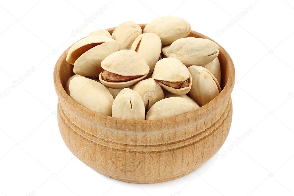 Pistachios in wooden bowl