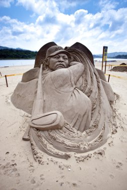 Golf player Yani Tseng sand sculpture clipart