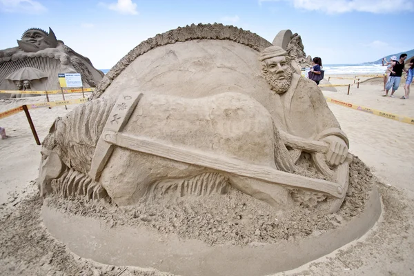 Farmer sand sculpture