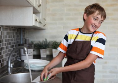 Boy doing the dishes clipart