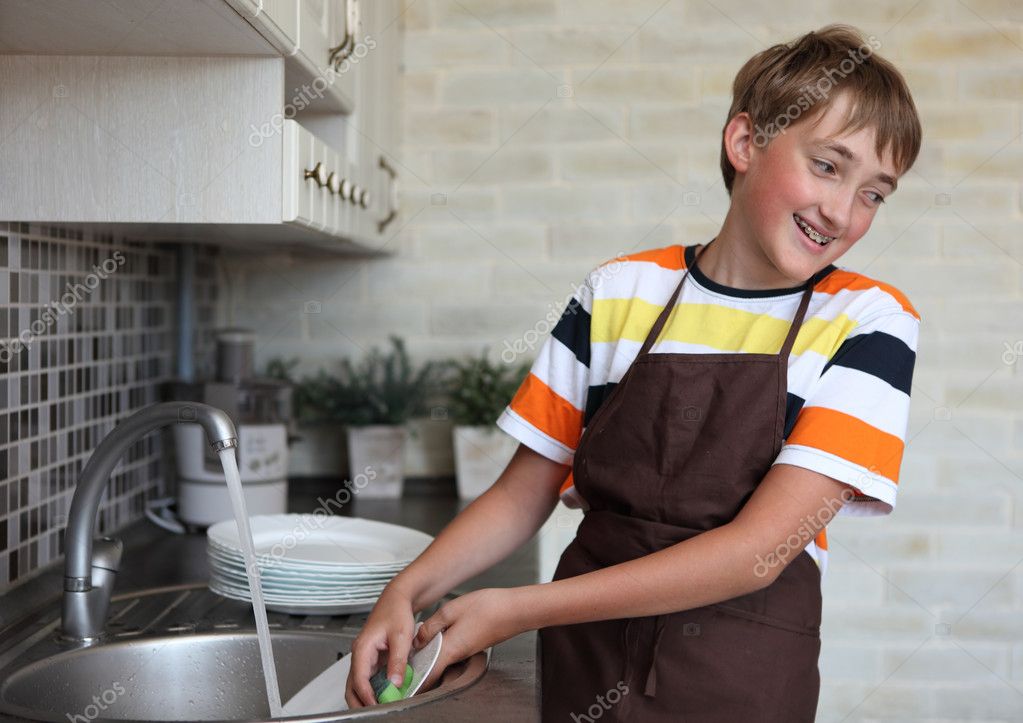 Boy doing the dishes Stock Photo by ©denizo 11670565