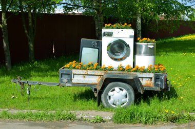 Trailer with home appliances. Tv and washing machine clipart