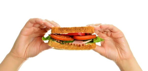 Woman's hands holding a sandwich, isolated on white — Stock Photo, Image