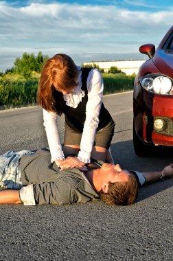 Young man reanimation on a road. Concept first aid clipart