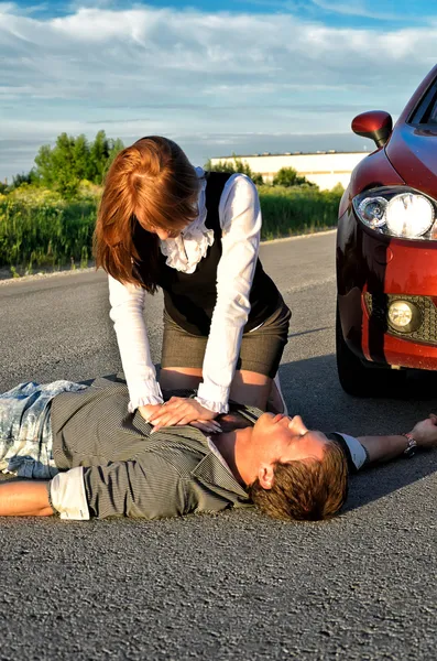 Young man reanimation on a road. Concept first aid — Stock Photo, Image