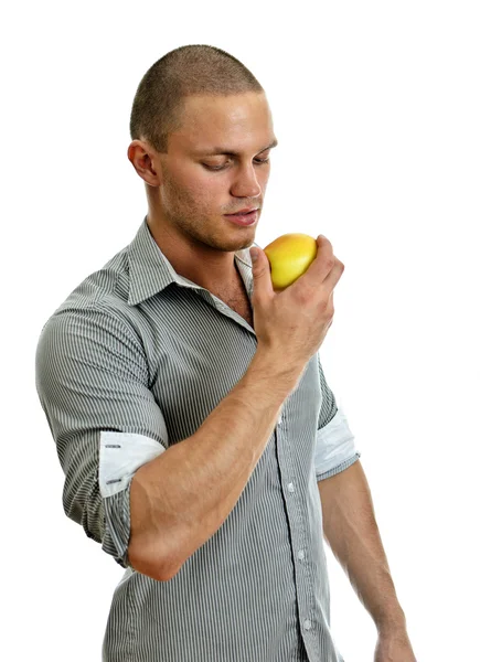 Seorang pria makan apel. Terisolasi di atas putih . — Stok Foto