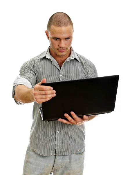 Un giovanotto con un portatile. Isolato su sfondo bianco . — Foto Stock