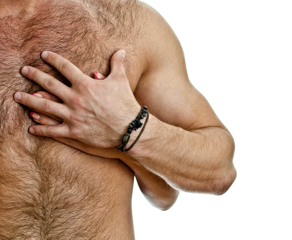 Männliche und weibliche Hand auf der Brust des Mannes. isoliert auf weiß. — Stockfoto