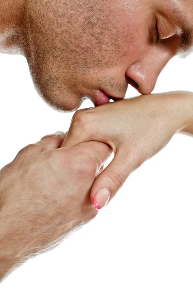 Чоловік цілує жінку за руку. Ізольовані на білому . — стокове фото