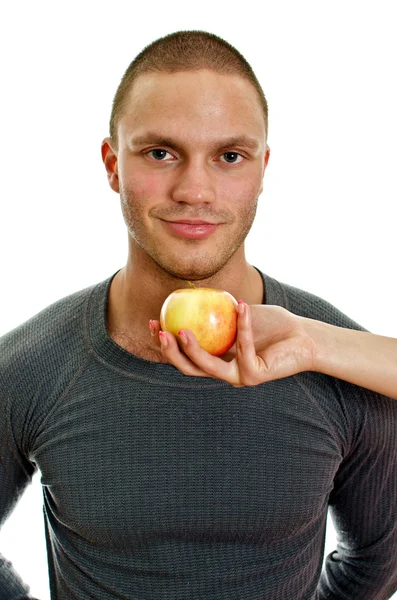 Tangan wanita menawarkan apel kepada manusia. Terisolasi di atas putih . — Stok Foto