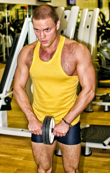 Portrait of handsome bodybuilder in fitness club — Stock Photo, Image