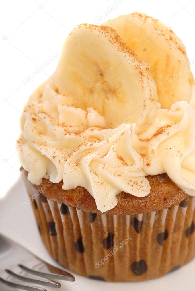 Delicious carrot cake cupcake with cream cheese frosting, sliced