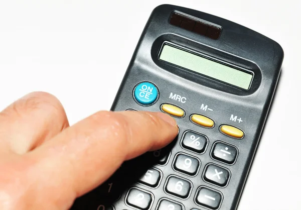 Hand and calculator — Stock Photo, Image