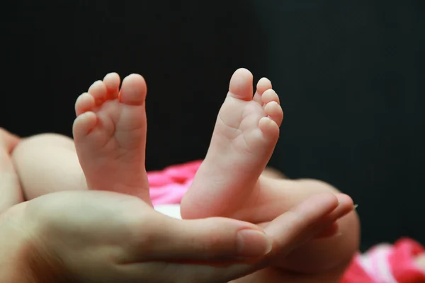 Маленькая детская нога Стоковое Фото