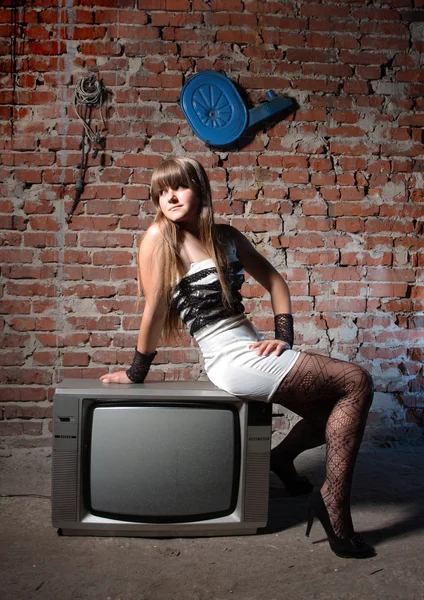 Girl on TV receiver — Stock Photo, Image