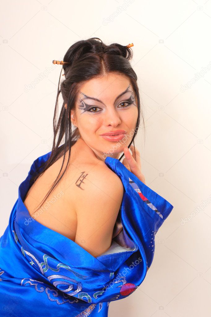 Girl in blue asian bathrobe with dragons