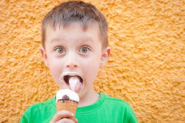 Boy having ice cream clipart