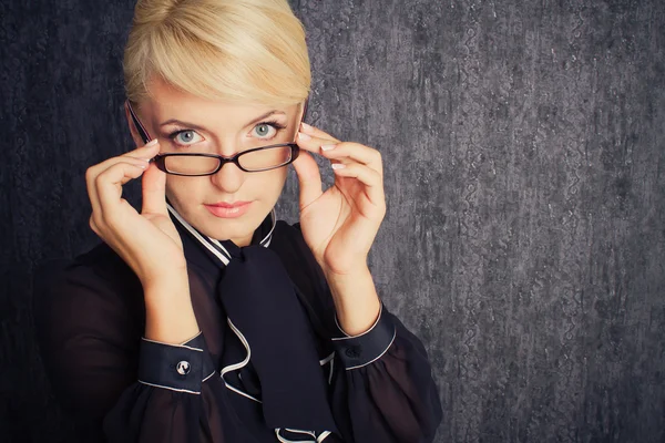 Stock image Blonde business woman in black suit with eyeglasses