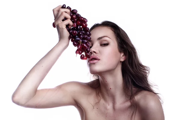 Stock image Beautiful young woman playing eating with grape