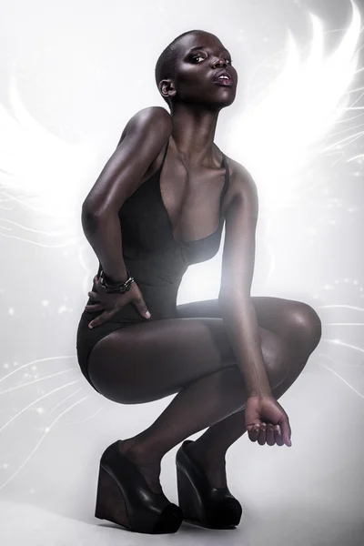 Black African American British fashion model with perfect skin lingerie studio portrait — Stock Fotó