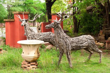 Two deer made from pieces of wood clipart