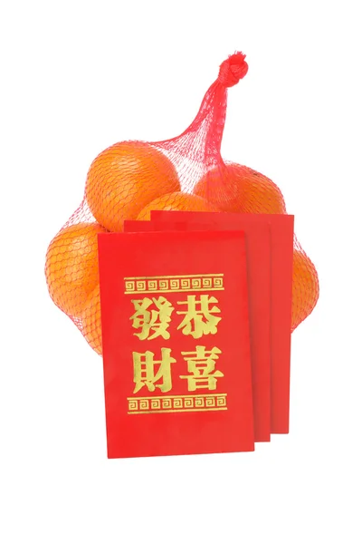 Chiński Nowy rok czerwony pakietów i pomarańcze — Zdjęcie stockowe