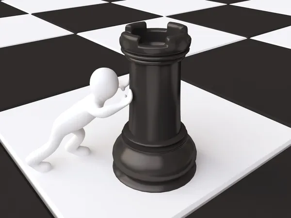 Man och svart chess torn — Stockfoto