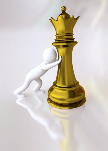 Mężczyzna naciskając postać królowej szachy — Zdjęcie stockowe